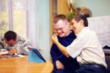 Three adults are spending time in shared housing.